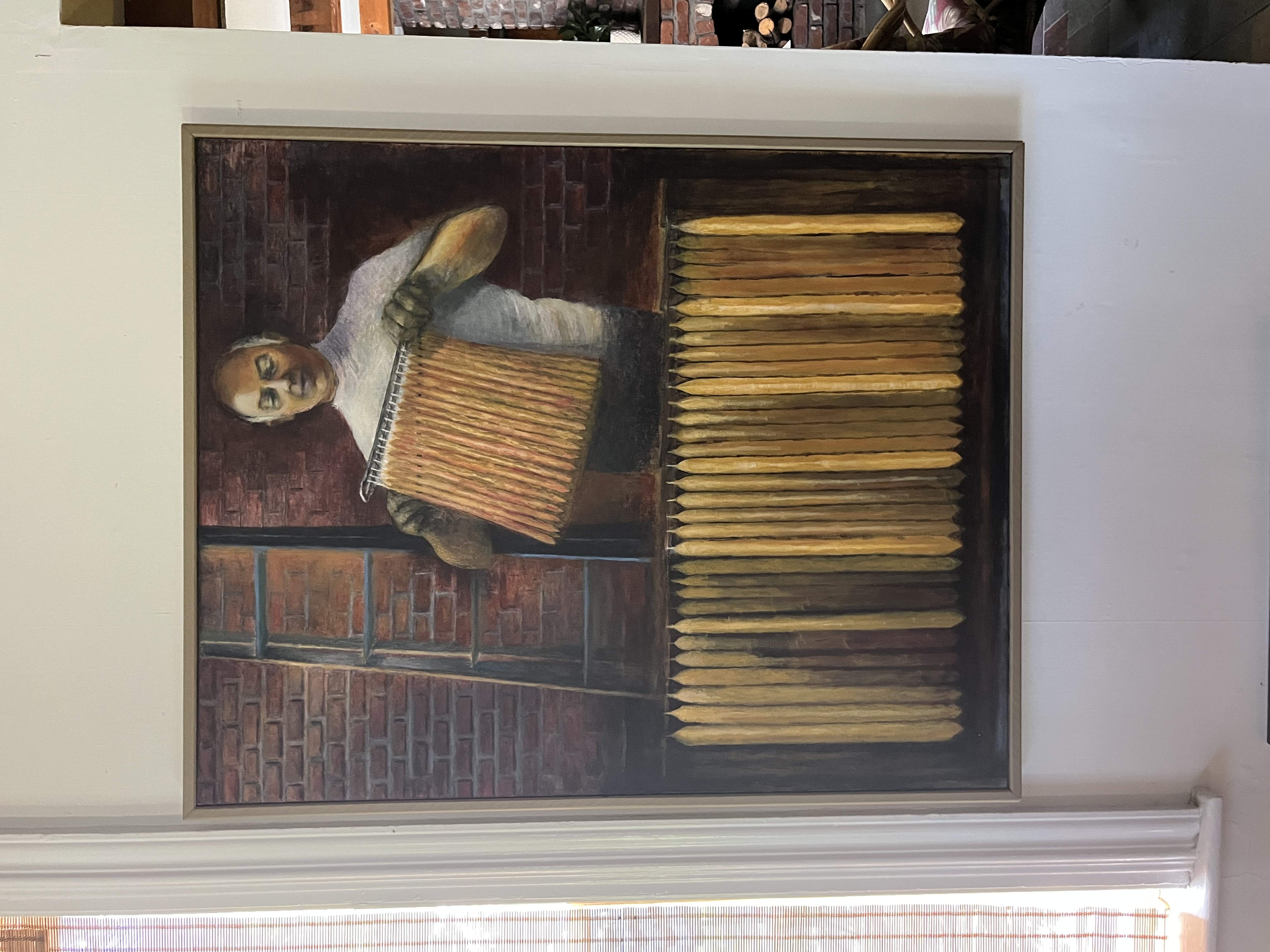 Nick Dristilaris, the candlemaker — grandfather portrait with rows of candles and ladder