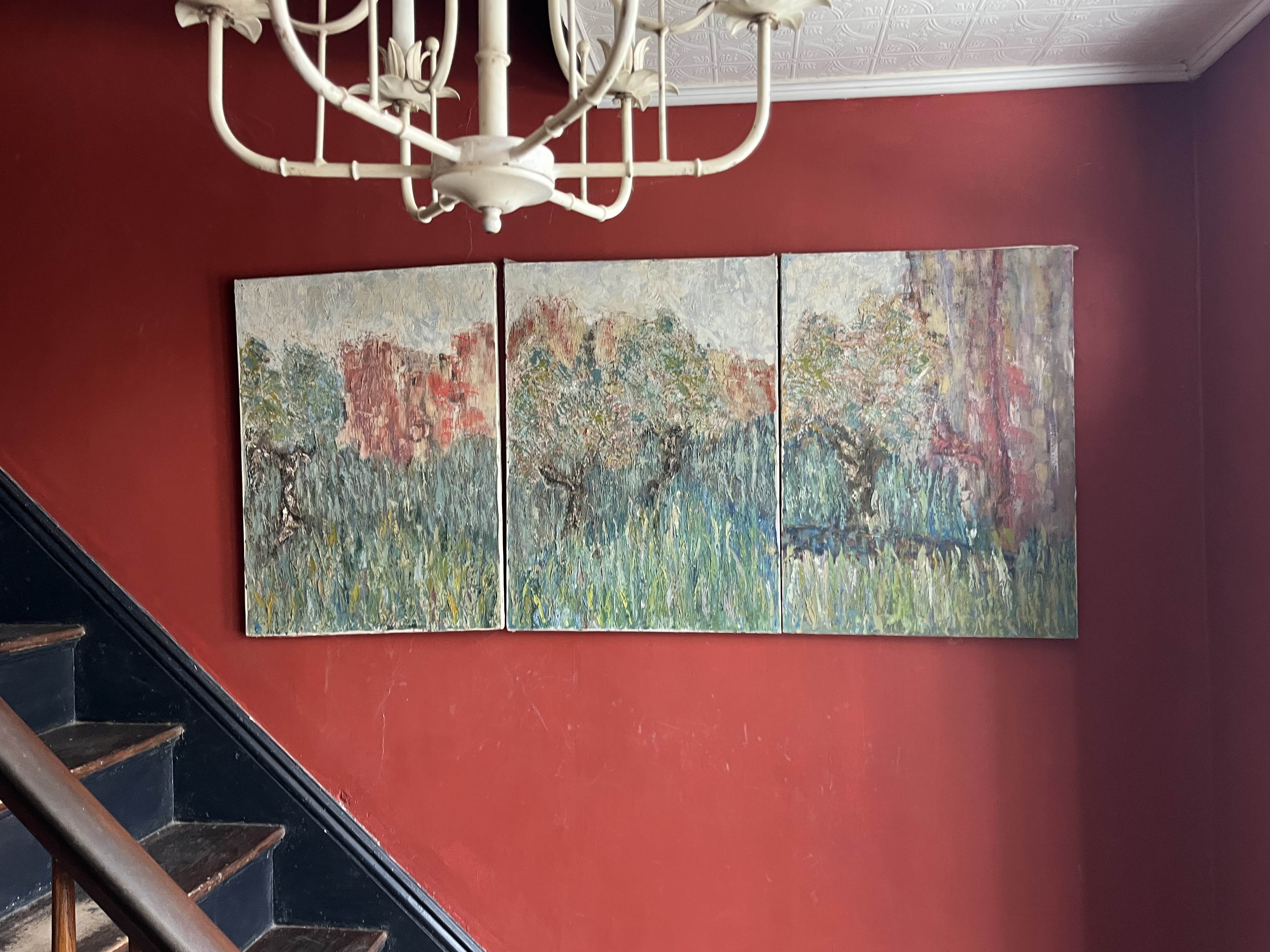 Kip's landscape triptych, installed on the red hallway wall